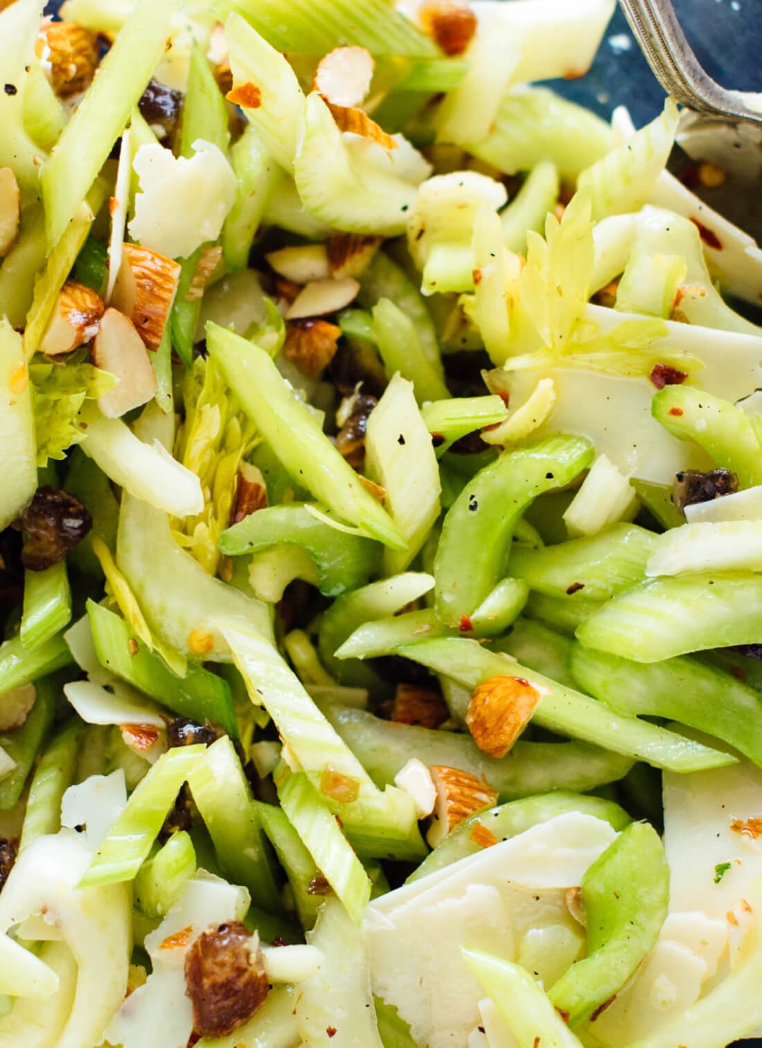 This celery salad recipe will surprise you! Crisp celery, toasted almonds, sweet dates and Parmesan combine to create an irresistibly fresh salad. cookieandkate.com