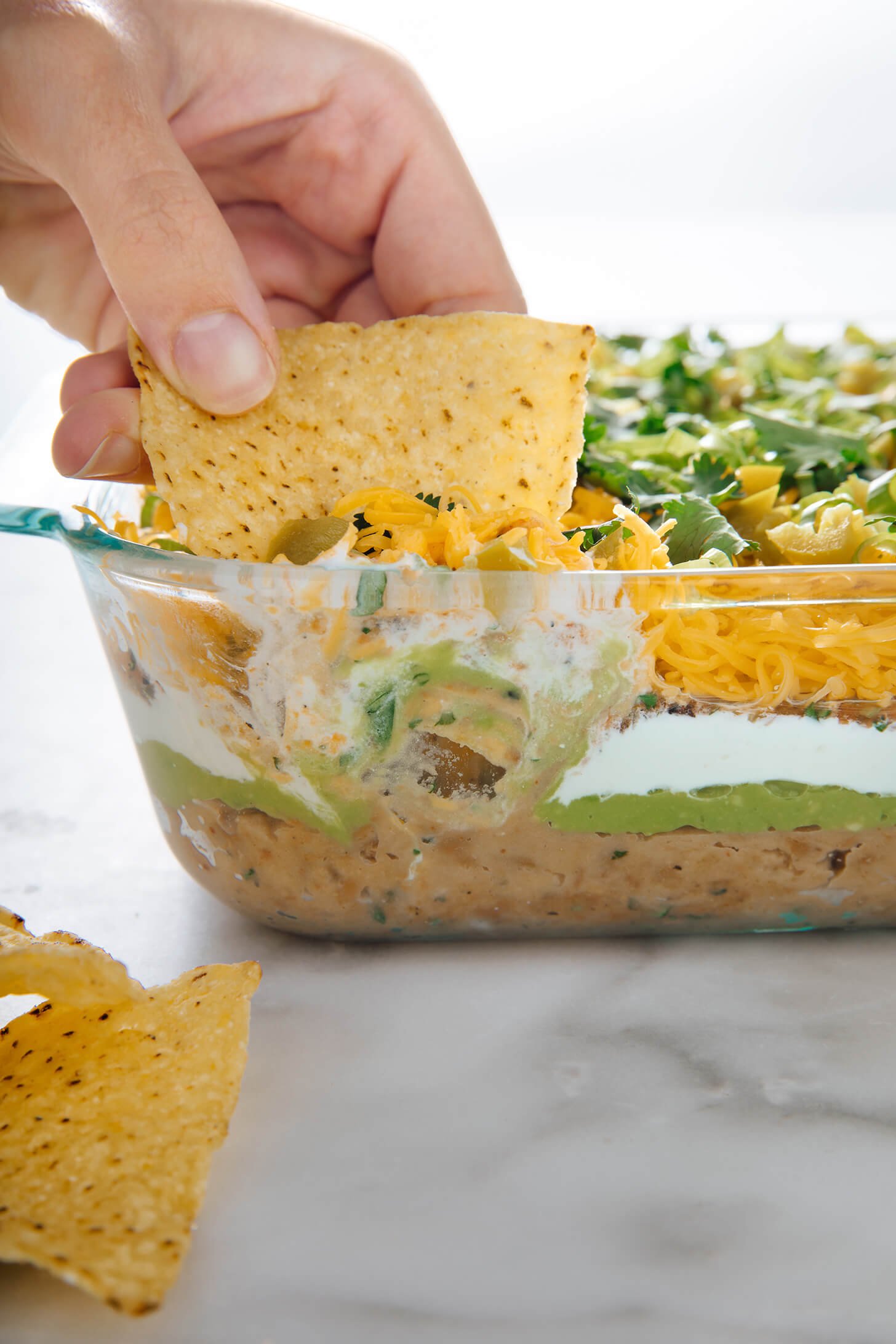 dipping chip into 7-layer dip