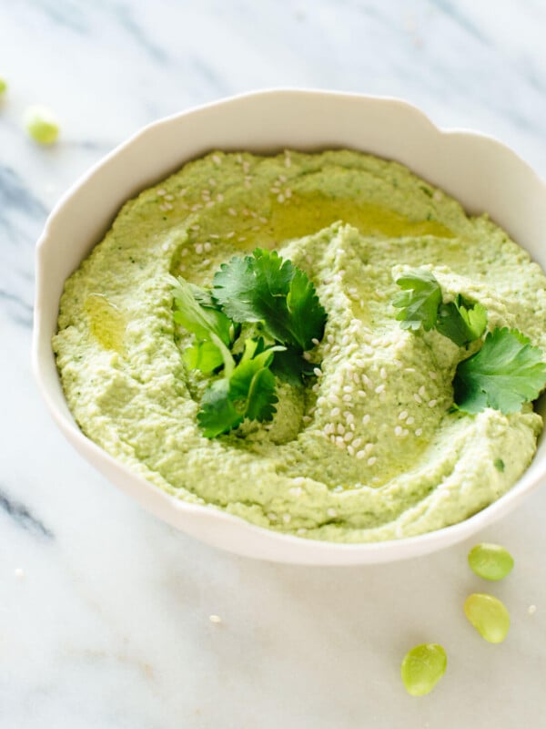 This edamame hummus recipe is fresh, healthy and delicious! It's a fun alternative to regular hummus and pairs well with traditional Mediterranean or Asian flavors. cookieandkate.com