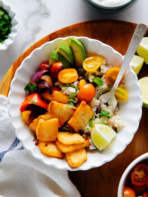 Vegetarian halloumi fajita bowl with black beans, rice, avocado and tomato