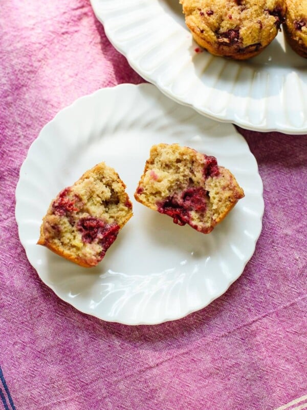 Amazing healthy raspberry muffins made with whole wheat flour, honey and frozen raspberries! cookieandkate.com