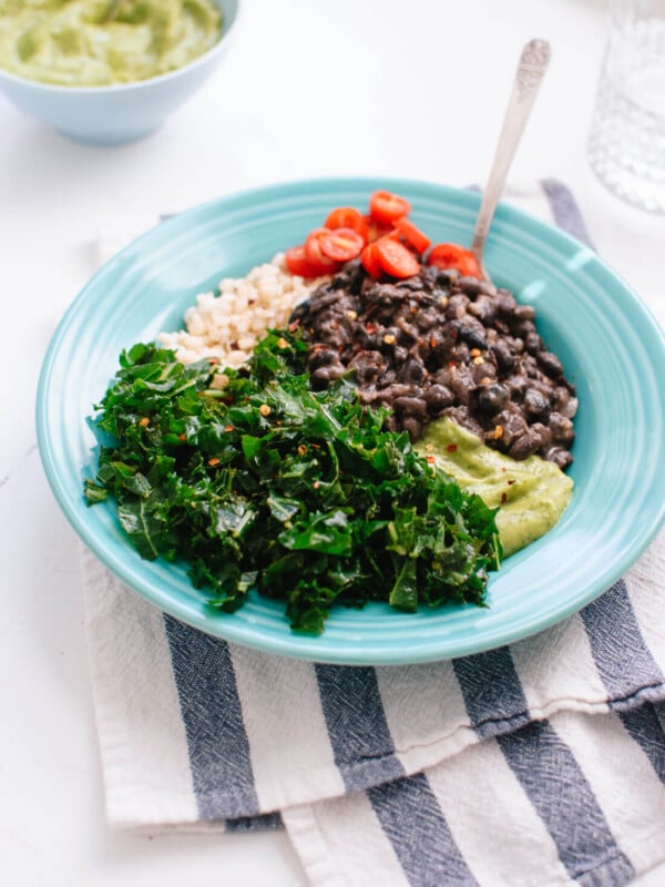 Kale black bean burrito bowls make a delicious, redeeming, vegan dinner that packs well for tomorrow's lunch. cookieandkate.com