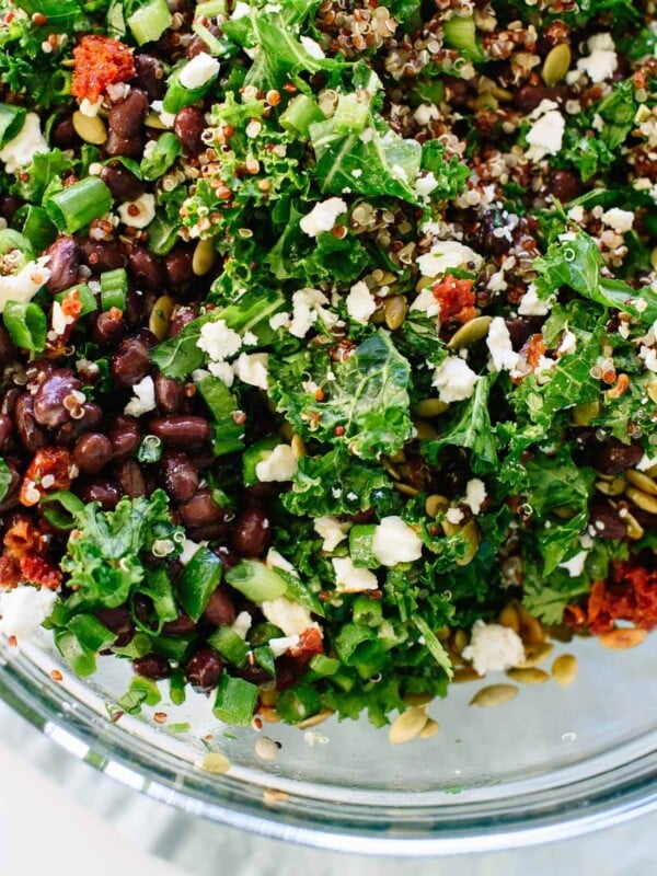 Healthy kale and quinoa salad recipe with Mexican flavors, including black beans, pepitas, and a cumin-lime dressing. Gluten free and easily vegan! cookieandkate.com