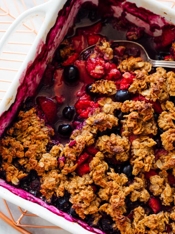 mixed berry crisp with serving spoon