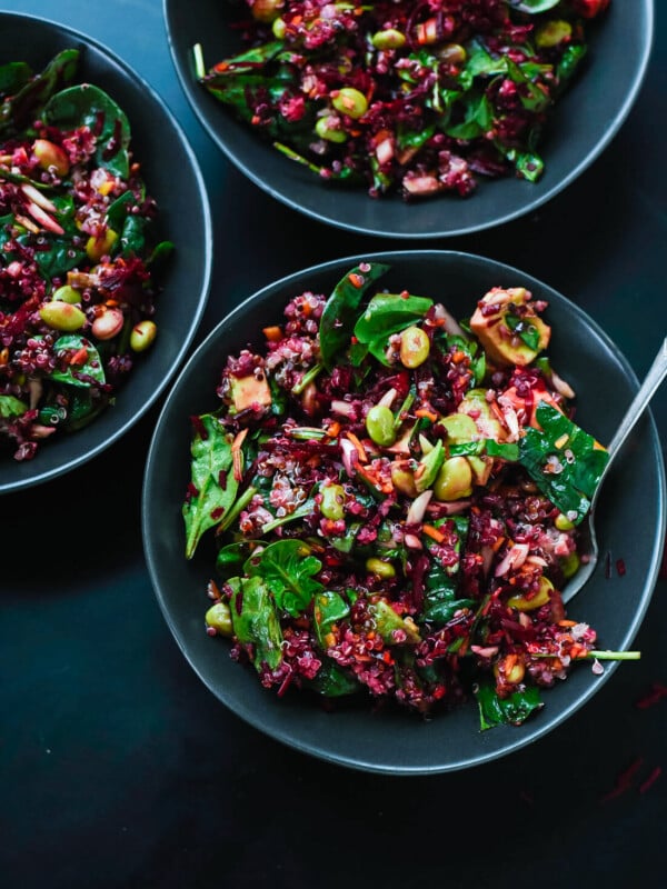 Raw Beet Salad with Carrot, Quinoa & Spinach in bowls