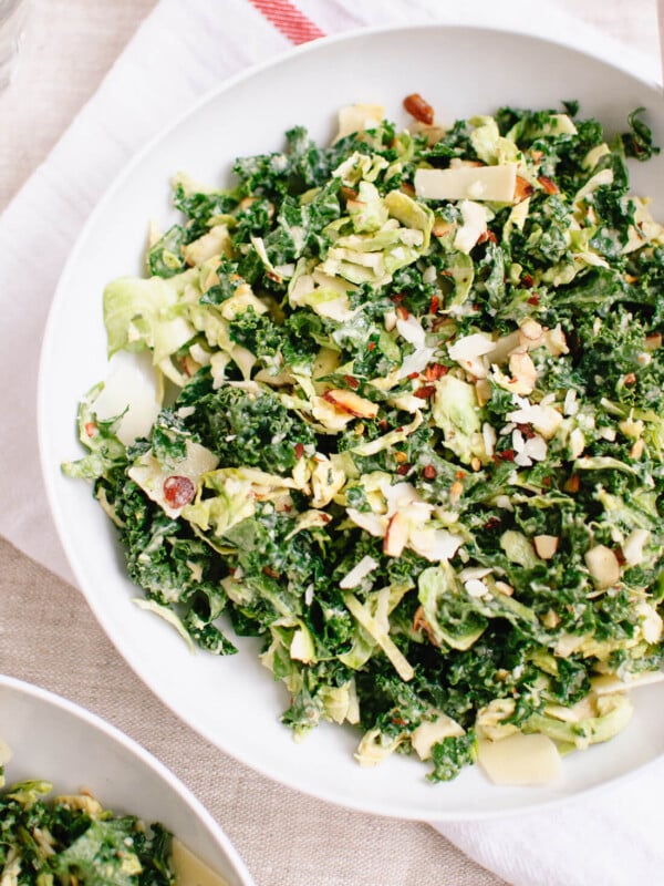 Raw kale and brussels sprouts salad with tahini-maple dressing