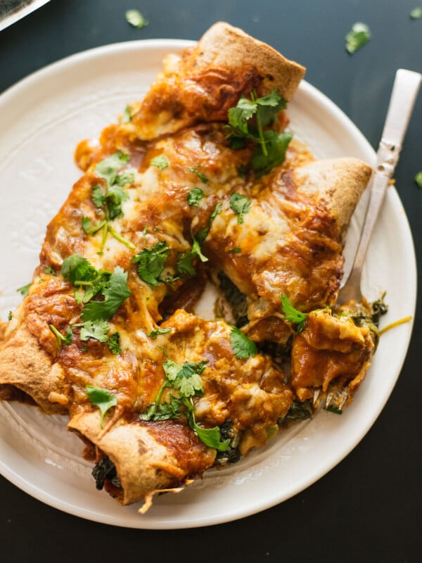 spinach artichoke enchiladas with a simple homemade red sauce