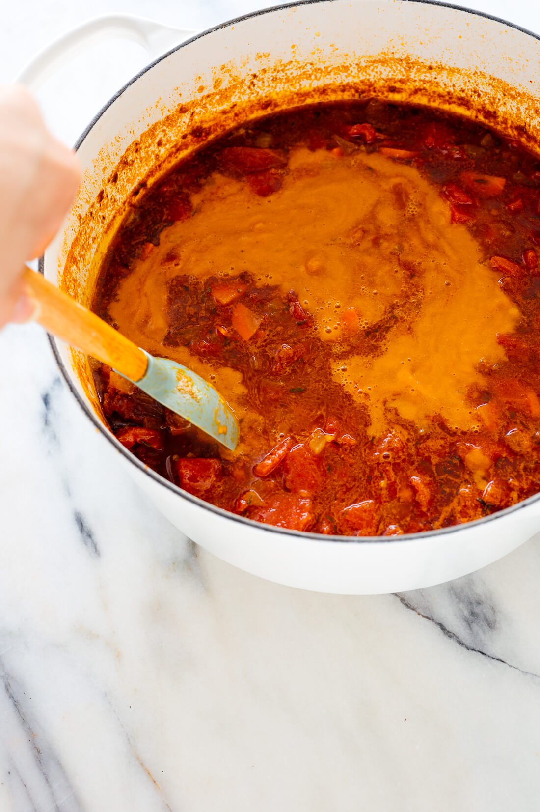 stirring soup to combine