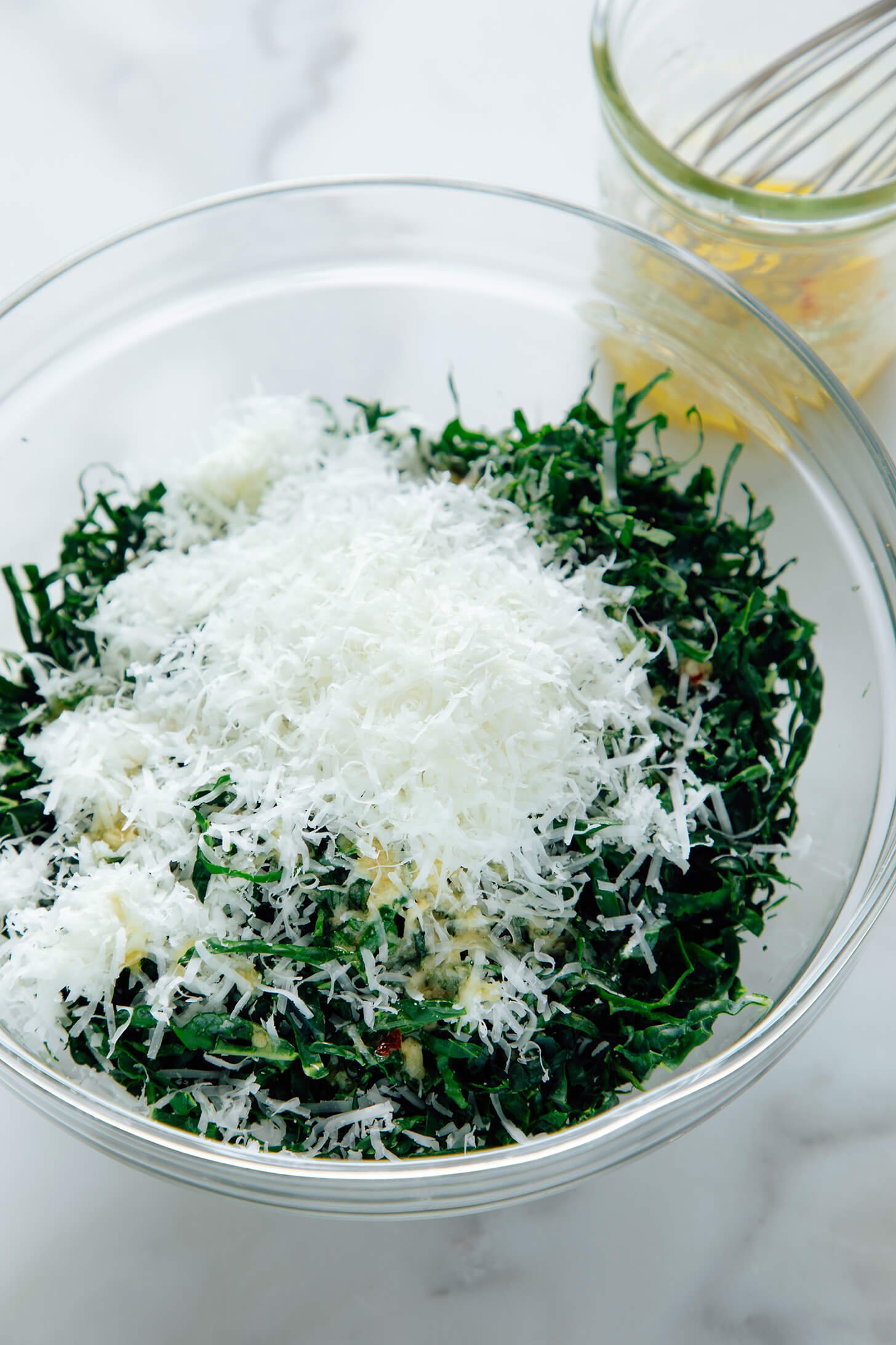 tuscan kale salad with parmesan on top