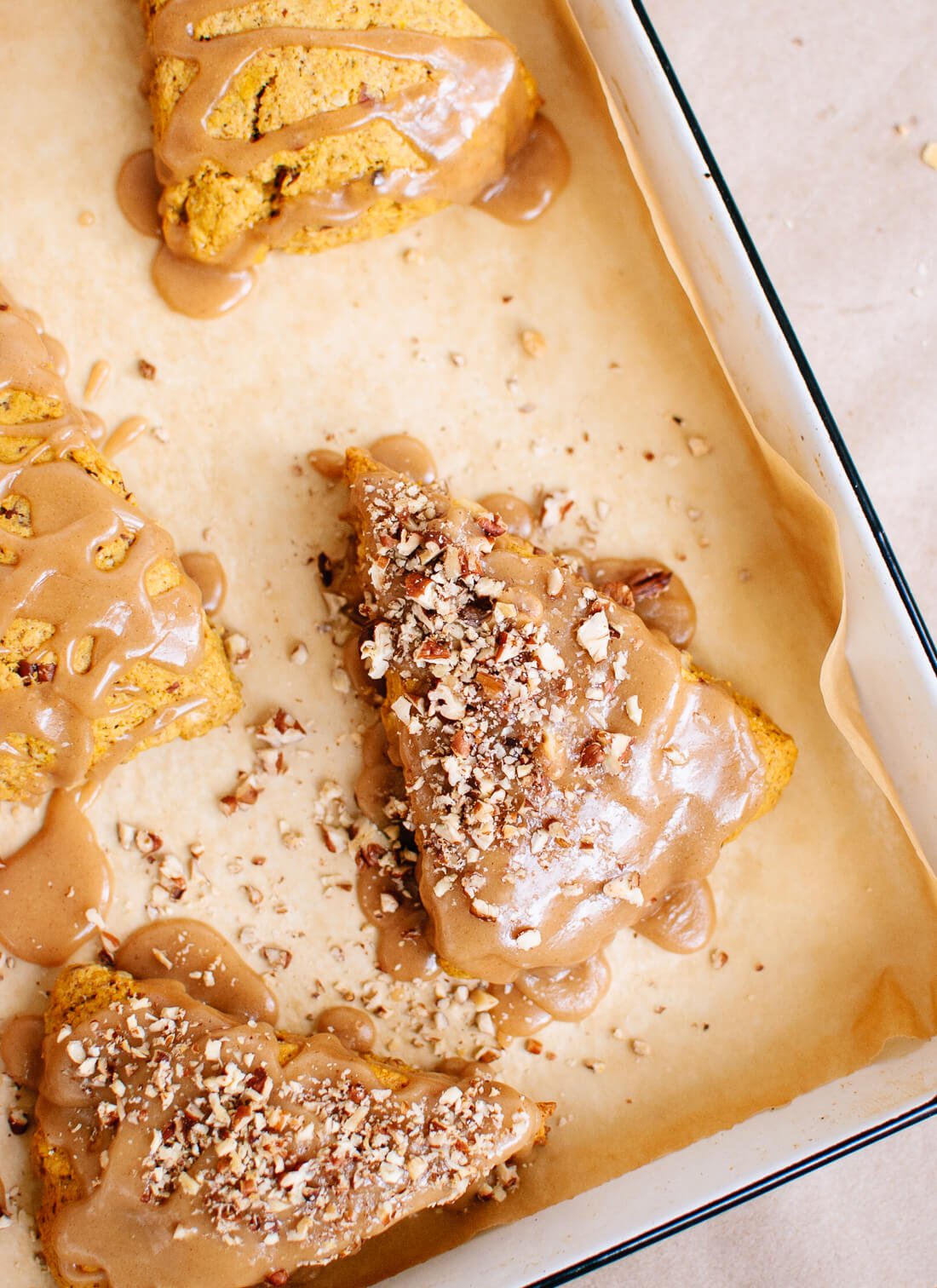 Healthy pumpkin pecan scones with maple glaze