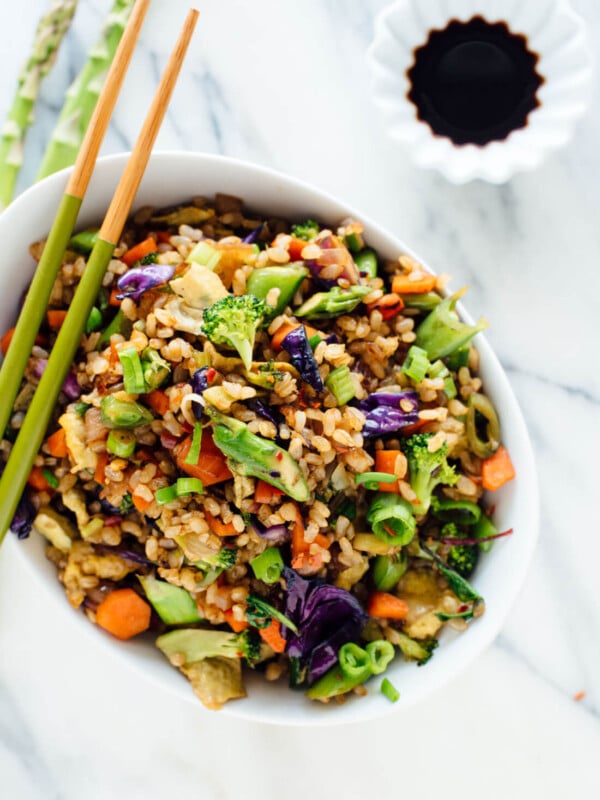 Vegetable fried rice made with extra veggies and brown rice, for health and flavor bonus points! Get the recipe at cookieandkate.com